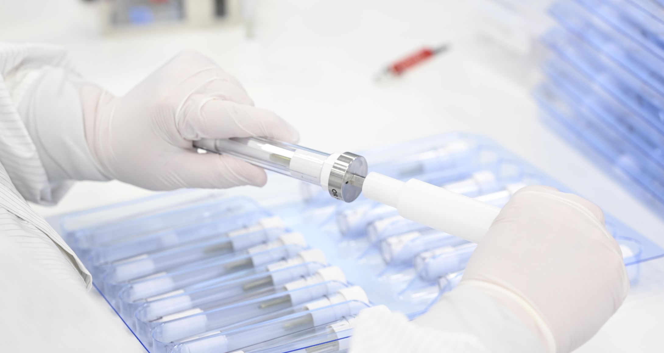 woman assembling Screw in tube packagign concept