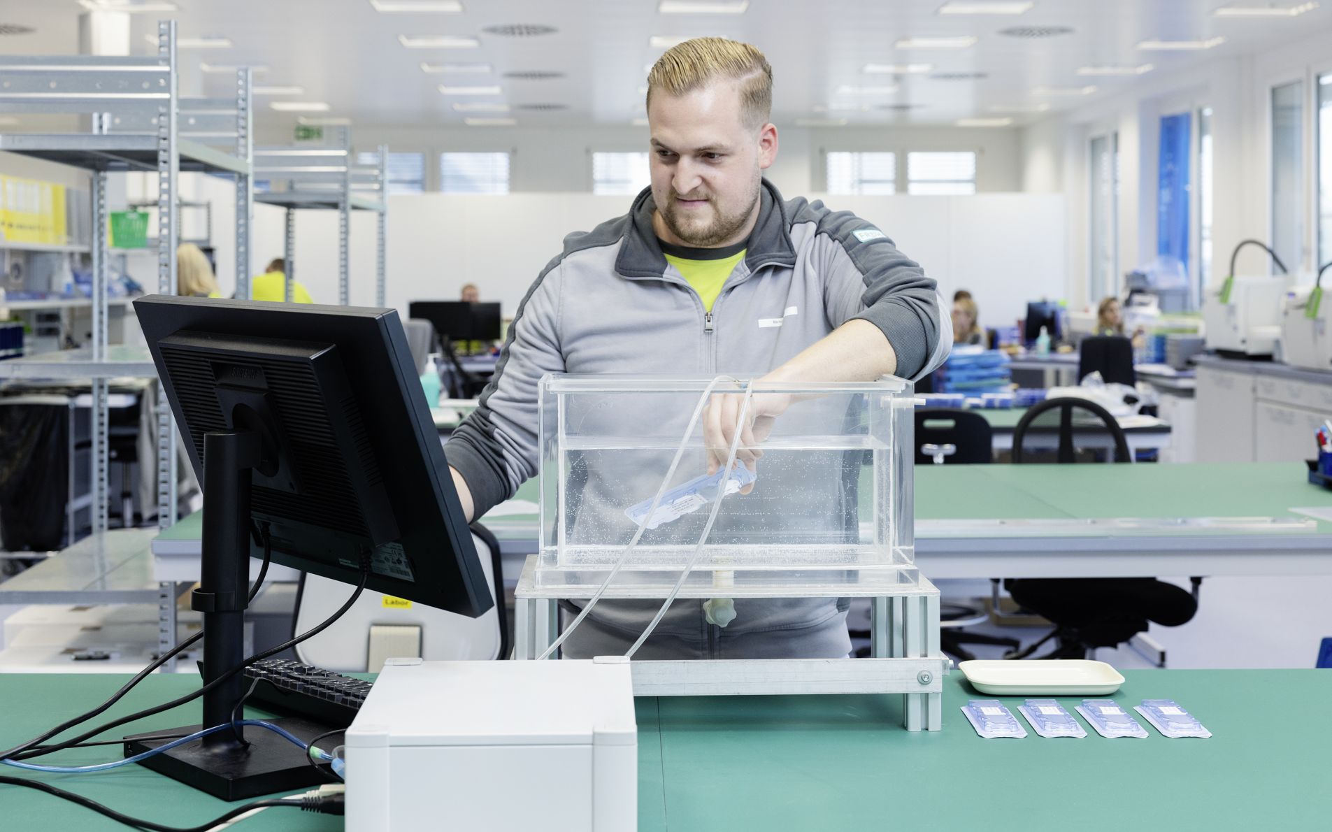 man in lab with bubble emission test